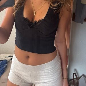 Black urban outfitters ribbed v-neck top size small lightly used; going out top